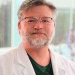 Michael E. Dicus,  MD