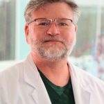 Michael E. Dicus,  MD